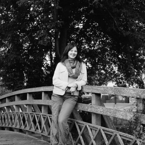 Zero Gravity member at Oxford leans against an iconic bridge